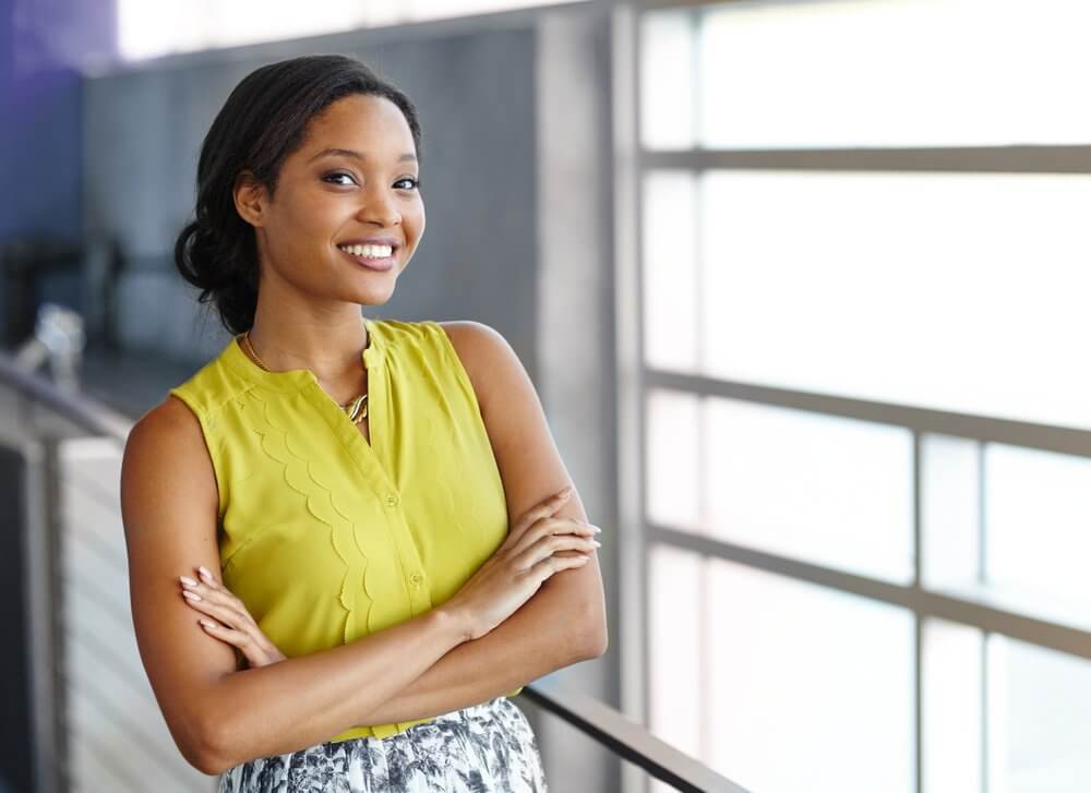 Portrait of a confident black businesswoman at work in her glass office Portrait of a confident black businesswoman at work in her glass office